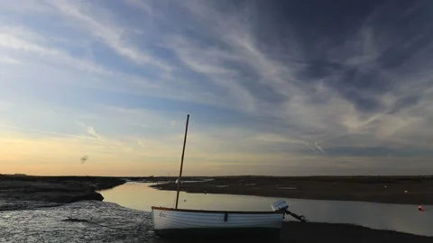 Sunset over the boats in Burnham Overy Staithe Quay, North Norfolk Stock Footage 165932887