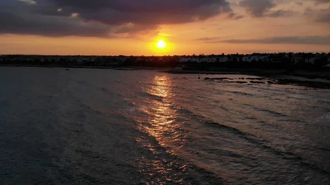 A sunset over a body of water Stock Footage 130113875