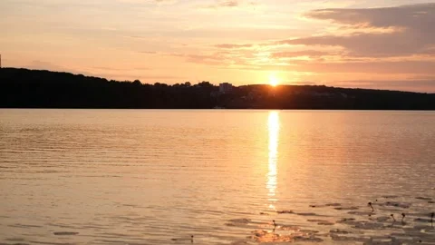 A sunset over a body of water Stock Footage 135429291