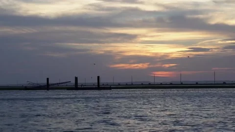 A sunset over a body of water Stock Footage 156023695