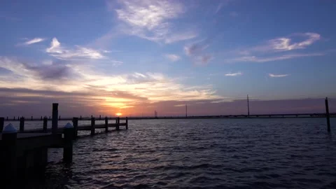 A sunset over a body of water Video stock 156024315