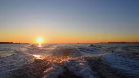 A sunset over a body of water Stock Footage 156024332