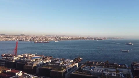 Sunset over the Bosphorus Strait, Istanbul, Turkey. Ferries float on water, view Stock Footage 148151278
