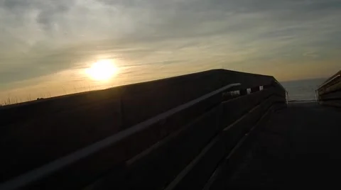Sunset over bridge/walkway on beach Stock-Footage 45464255
