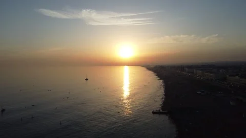 Sunset Over Brighton Beach – HD Drone Forward Shot Stock Footage 319763053