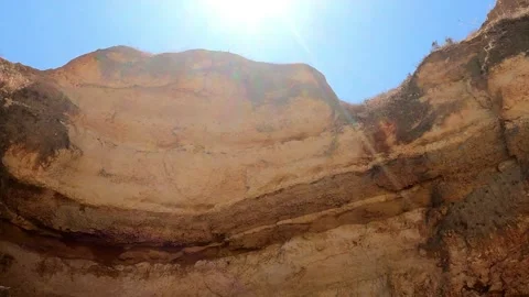 Sunset Over Brown Beach Rocks Stock Footage 287561274