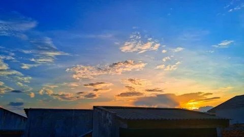 Sunset over buildiing,dramatic sky cloud pattern,sunset concept background Stock Photos