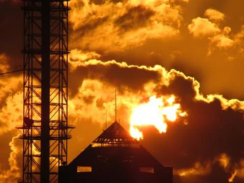 Sunset over a building in the clouds Stock Illustration