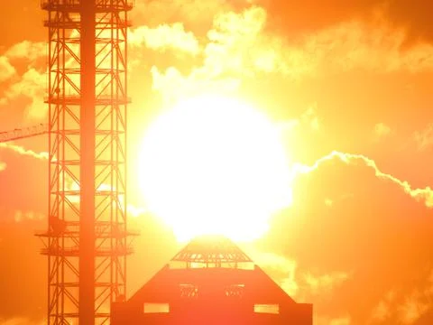 Sunset over a building in the clouds 스톡 일러스트