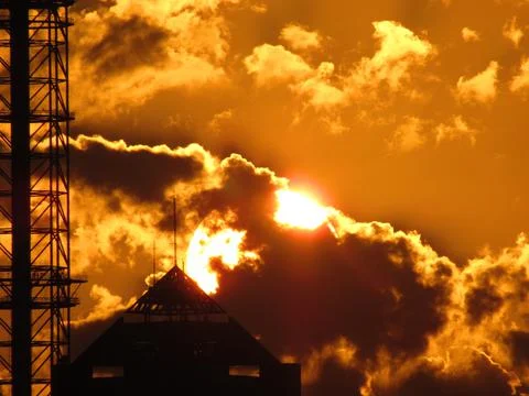 Sunset over a building in the clouds 스톡 일러스트