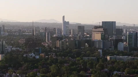 Sunset over buildings in CDMX with a parallax effect from a drone shot Stock-Footage 307264195