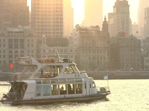 Sunset over the bund with boat close-up Stock Footage 10891118