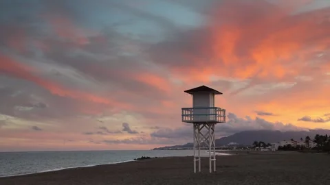 Sunset Over Calm Beach With Lifeguard Tower Playa Vera, Palomares, Spain Stock Footage 327867011