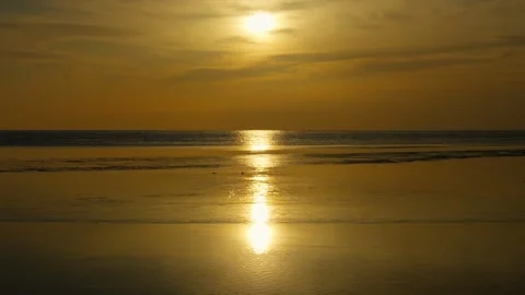 Sunset Over Calm Coastal Waters — Golden Reflections and Peaceful Atmosphere 動画素材 312919768
