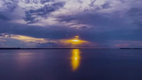 Sunset over calm lake with dramatic sky. Stock Footage 305682190