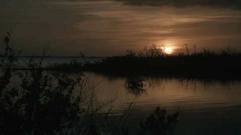 Sunset over calm lake Stock Footage 97603260