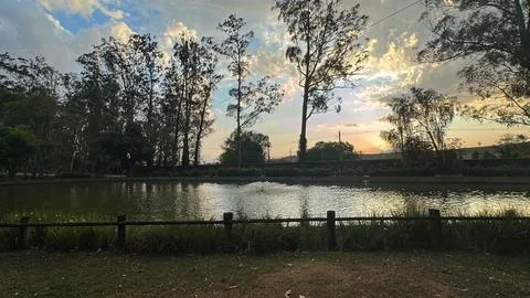 Sunset over a calm lake Stock Photos