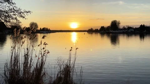 Sunset Over Calm Lake With Reflections Stock Footage 337645424