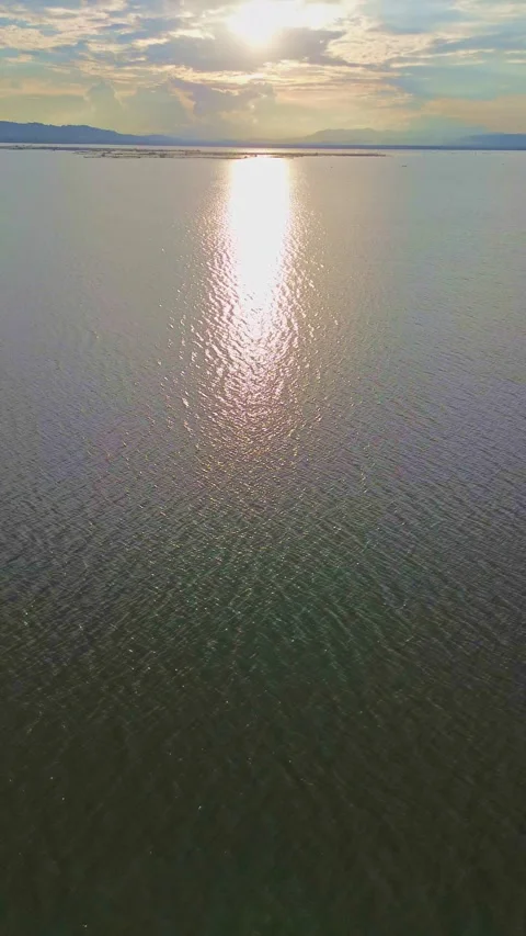 Sunset Over Calm Lake with Sky Reflection Stock Footage 311662013