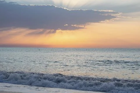 Sunset Over Calm Ocean Waves Stock Photos