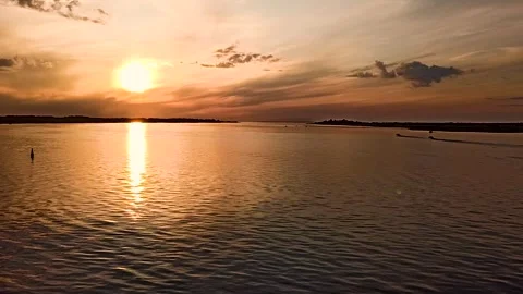 Sunset over a calm, reflective lake. Stock Footage 340895822