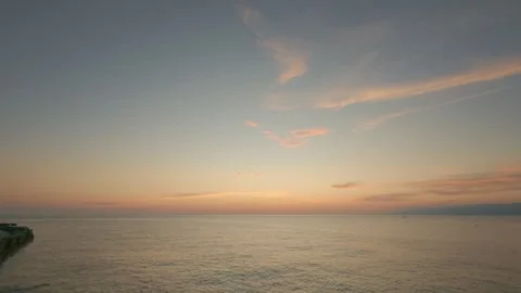 Sunset Over Calm Sea with Dramatic Clouds Stock Footage 311962553