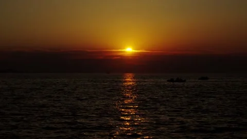 Sunset over calm sea with reflections Video stock 340073304