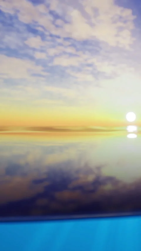 Sunset over calm water with clear sky reflecting vibrant colors and light Stock Footage 332231915