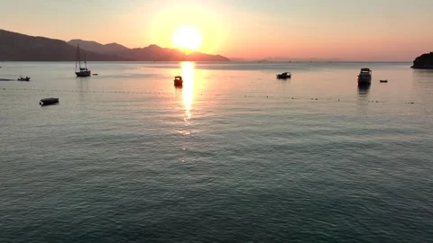 Sunset Over Calm Waters with Boat Stock Footage 282931196
