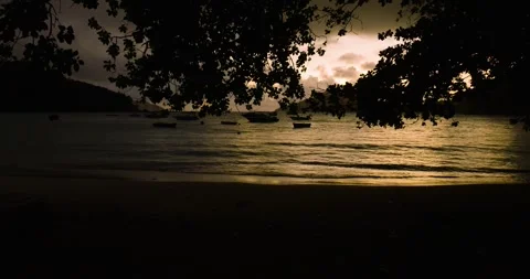 Sunset over calm waters with boats. Seychelles, Mahe. Stock Footage 322014966