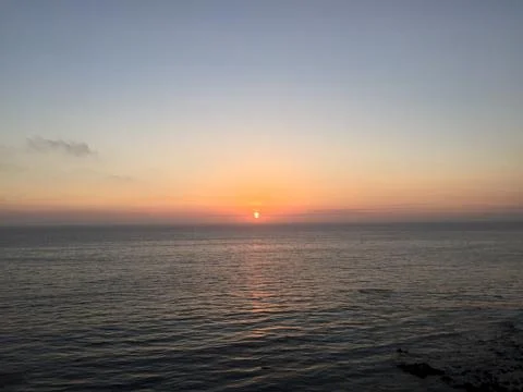 Sunset Over Calm Waters Creates a Tranquil Evening Atmosphere Stock Photos