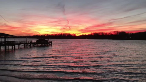 Sunset over calm waters Stock Footage 169754468