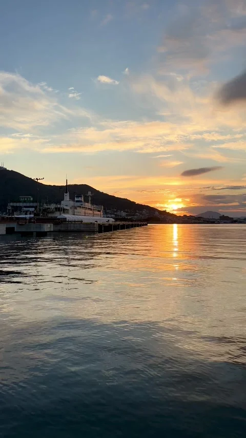 Sunset over the calm waters of Hakodate Bay Stock Footage 278827399