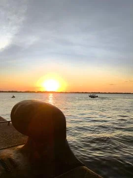 Sunset over calm waters Stock Photos