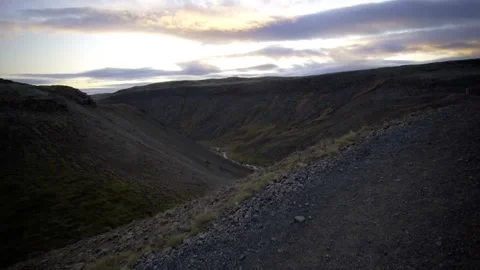 Sunset over the canyon. small river flows through the canyon Stock Footage 130441494