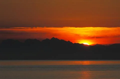 Sunset over the Cascade Mountains from Cabbage Island, British Columbia Stock Photos
