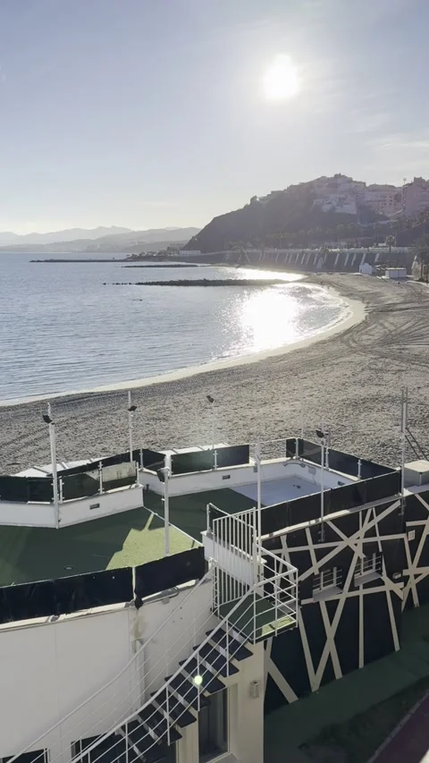 Sunset over Ceuta at Ribera Beach with Morocco on the horizon Stock Footage 311028037