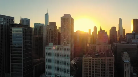 Sunset over Chicago skyline with river view, The sun sets behind Chicago's Stock Footage 289554467