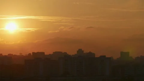 Sunset over the city buildings Stock Footage 168769162