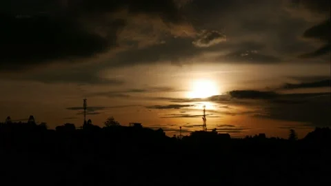 Sunset over the city in the mountains. Dramatic majestic amazing sky and the Stock Footage 139675100