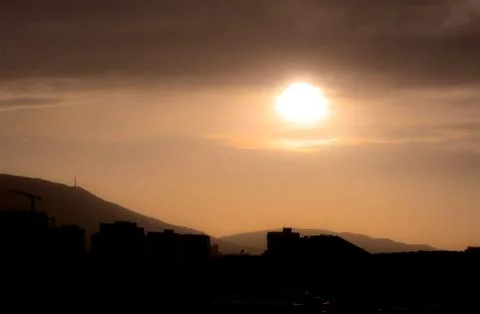 Sunset over the city Stock Photos