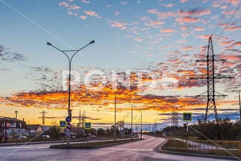Sunset over the city road. Stock Photos