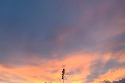 Sunset over city skyline with dramatic twilight colors Stock Photos