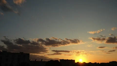 Sunset over city static timelapse. Dramatic cloudy sky, beautiful nature scene Stock Footage 251730681