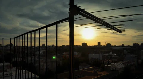 Sunset over the city with striking clouds at the top of the skyscraper Stock Footage 22481012