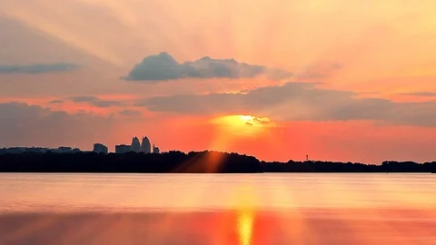 Sunset over the city. sun rays of sunset. Stock Footage 120187896