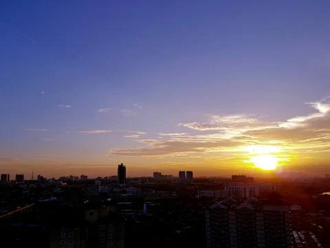 Sunset over cityscape Stock Photos