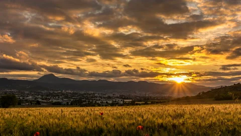 Sunset over Clermont-Ferrand and the chain of puys Stock Footage 149940885