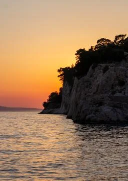 Sunset over cliff Stock Photos