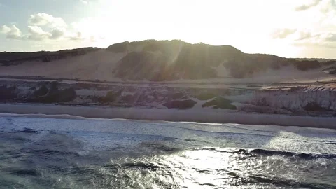 Sunset over cliffs and ocean at Praia de Pipa, Rio Grande do Norte. Stock Footage 314401475